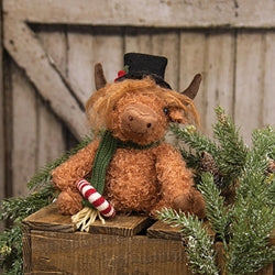 Sitting Highland Cow w/ Candy Cane
